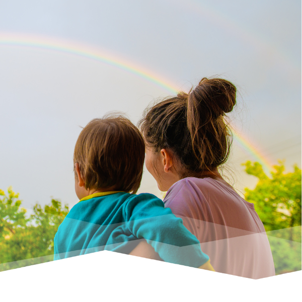 Mother and child looking at a rainbow.