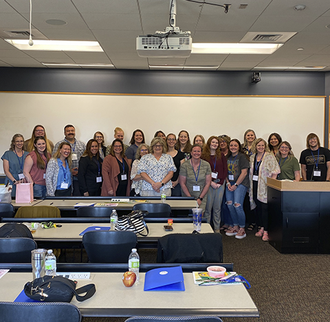 A group photo of training participants and trainers.